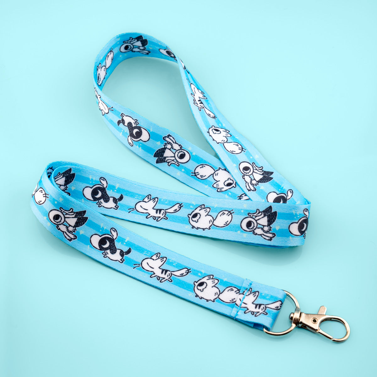 Blue lanyard with Anxiety Fox, Calming Kitty, Support Bunny, and ADHD Puppy Printed
