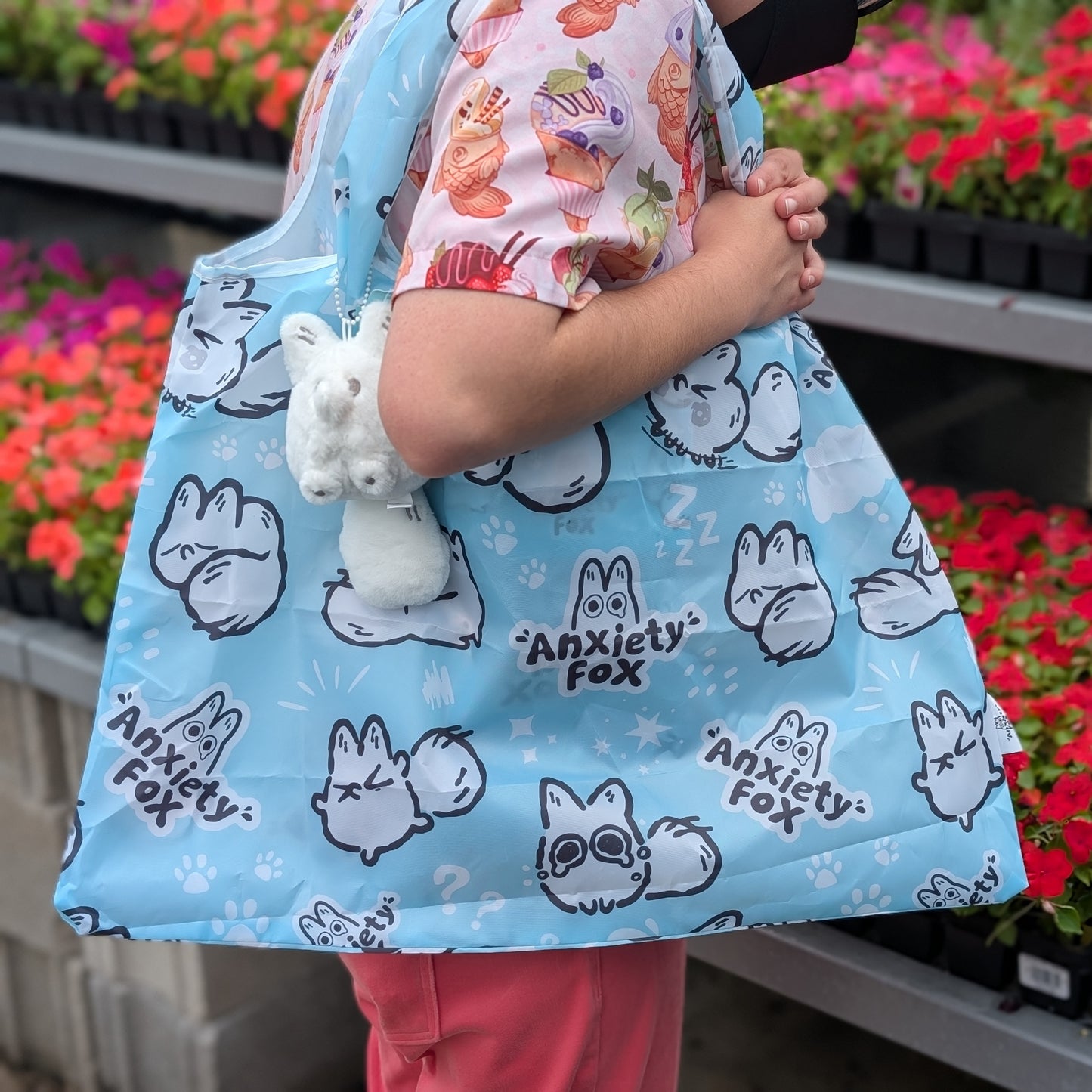 Polyester reusable totebag for shopping, covered with the Anxiety Fox character and motifs.