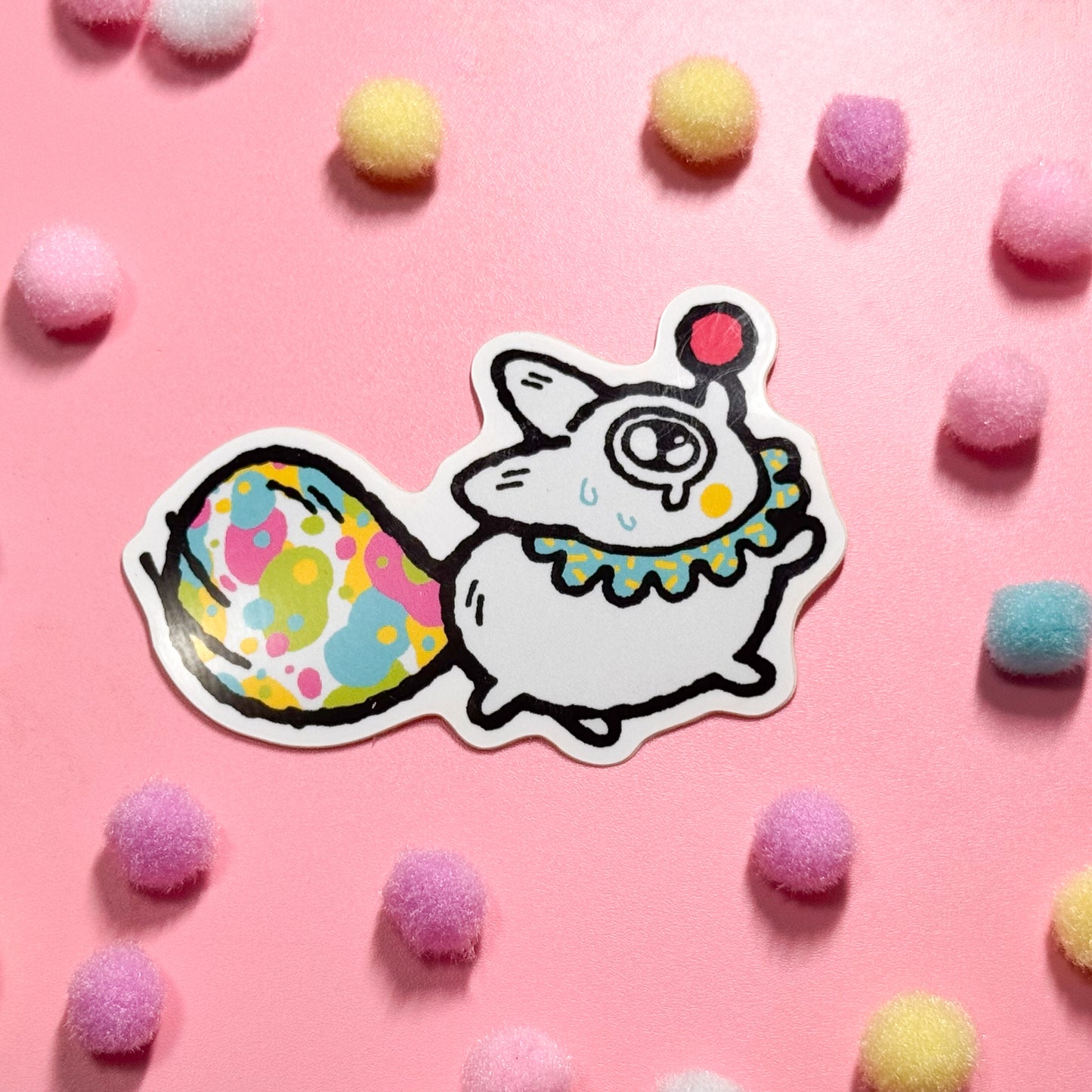 Vinyl sticker features Anxiety Fox as a clown, with a colorful tail and a teary expression!