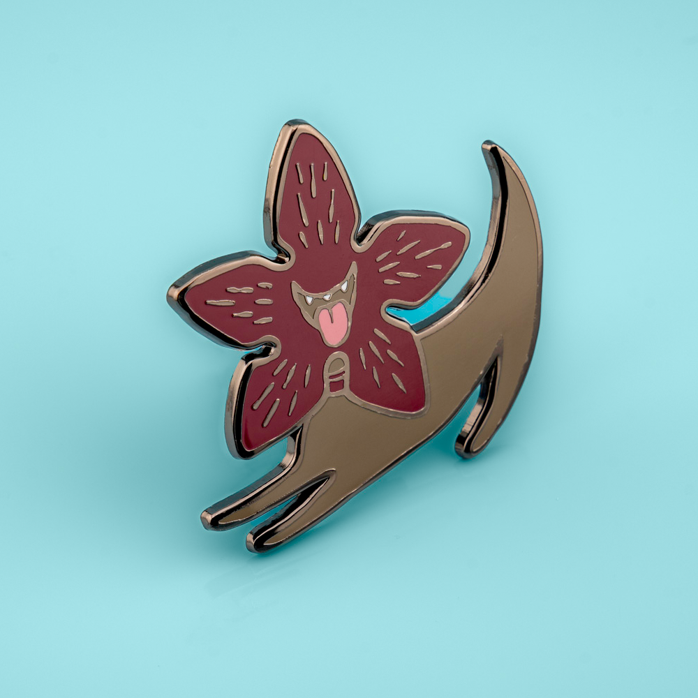 Made By Nao! Demodog enamel pin featuring a detailed, colorful design on a metal pin backing.
