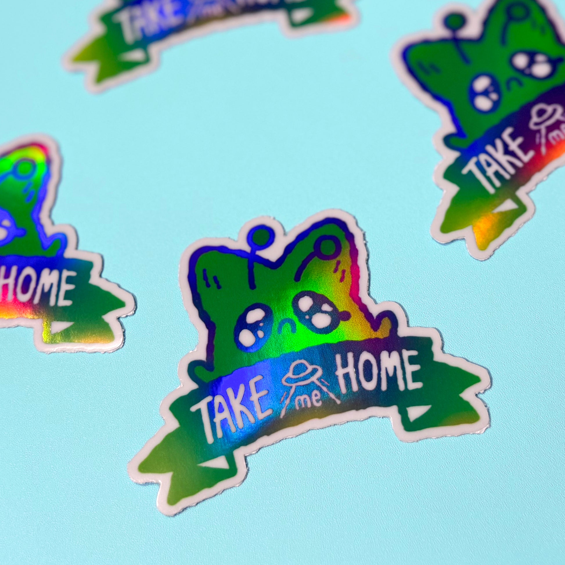 Colorful stickers with 'Take me Home' text on a light blue background