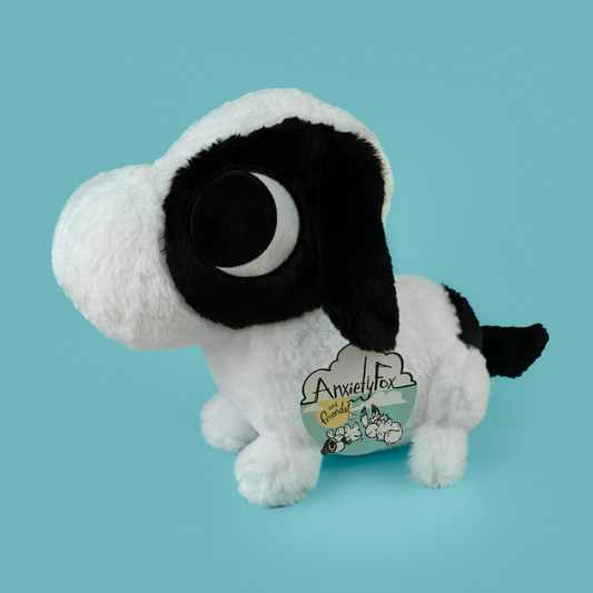 Plush toy of ADHD Puppy, the black and white puppy.