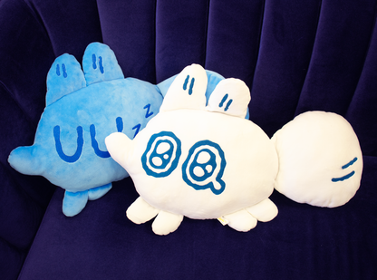 Two plush cushions from Made by Nao! featuring big feelings with colorful, soft fabric and expressive designs for comfort and fun.