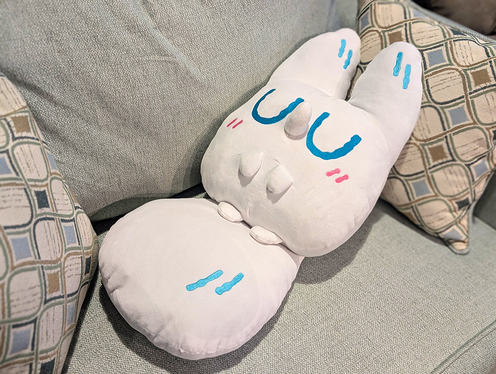 Made by Nao! Gentle Friends Jumbo Anxiety Fox plush toy sitting on a couch, soft and cuddly with detailed fox features.