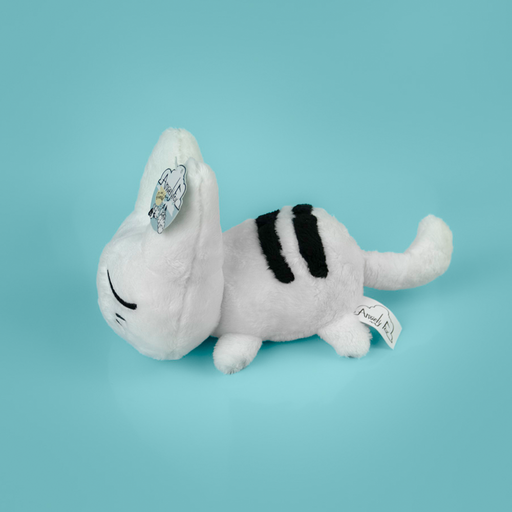 White plush cat toy with black accents on a light blue background