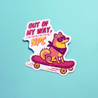 Sticker with a Shiba Inu dog on a skateboard and text 'Out of my way, NPC' on a light blue background