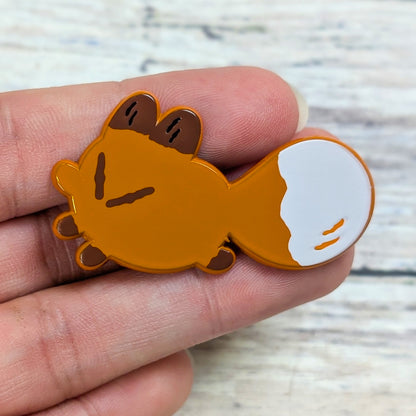 Red fox enamel pin from Made By Nao! Smol Feelings collection, featuring a cute fox holding its tail.