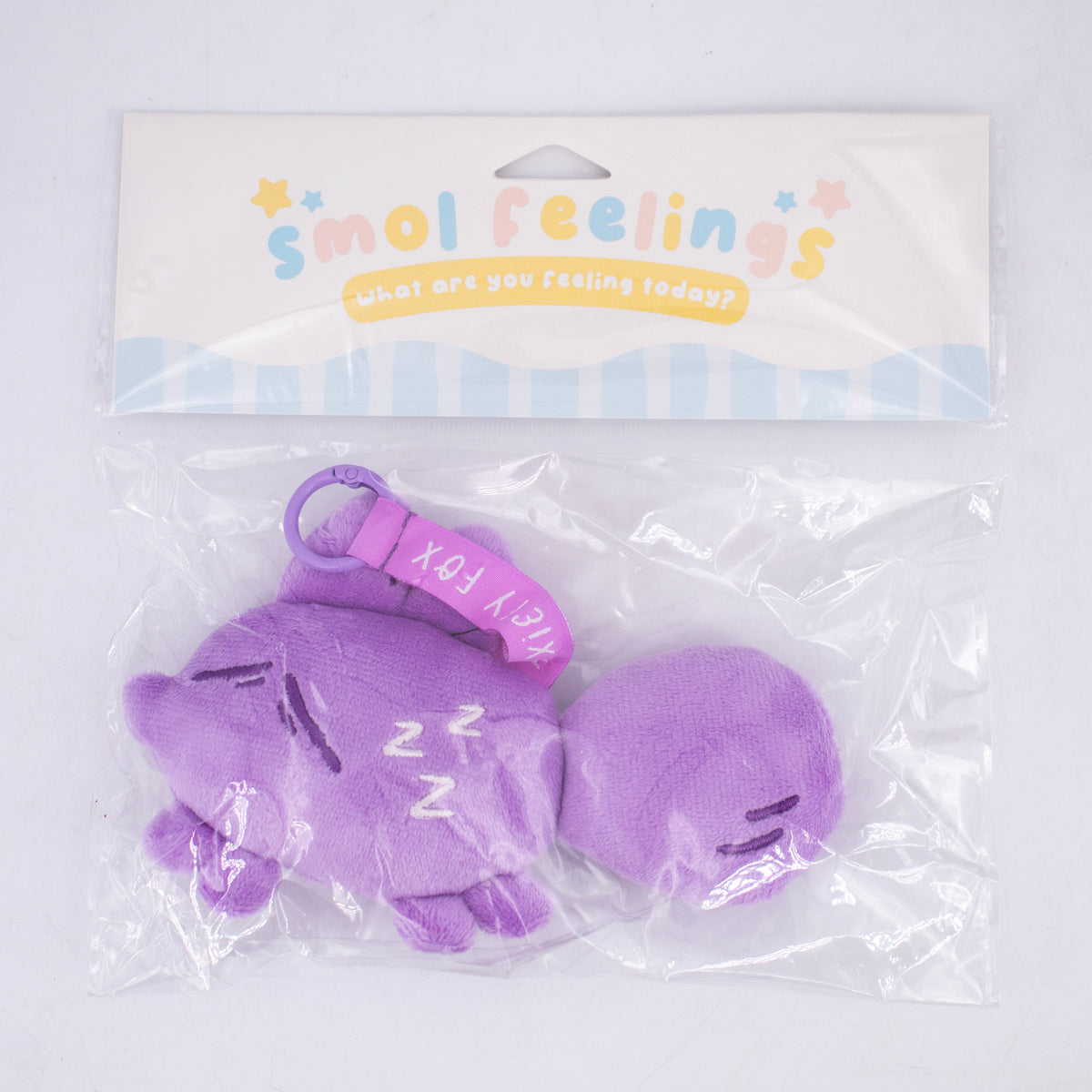 Smol Feelings mood plush toy by Made By Nao! Soft, colorful plush with sleepy expression in packaging.