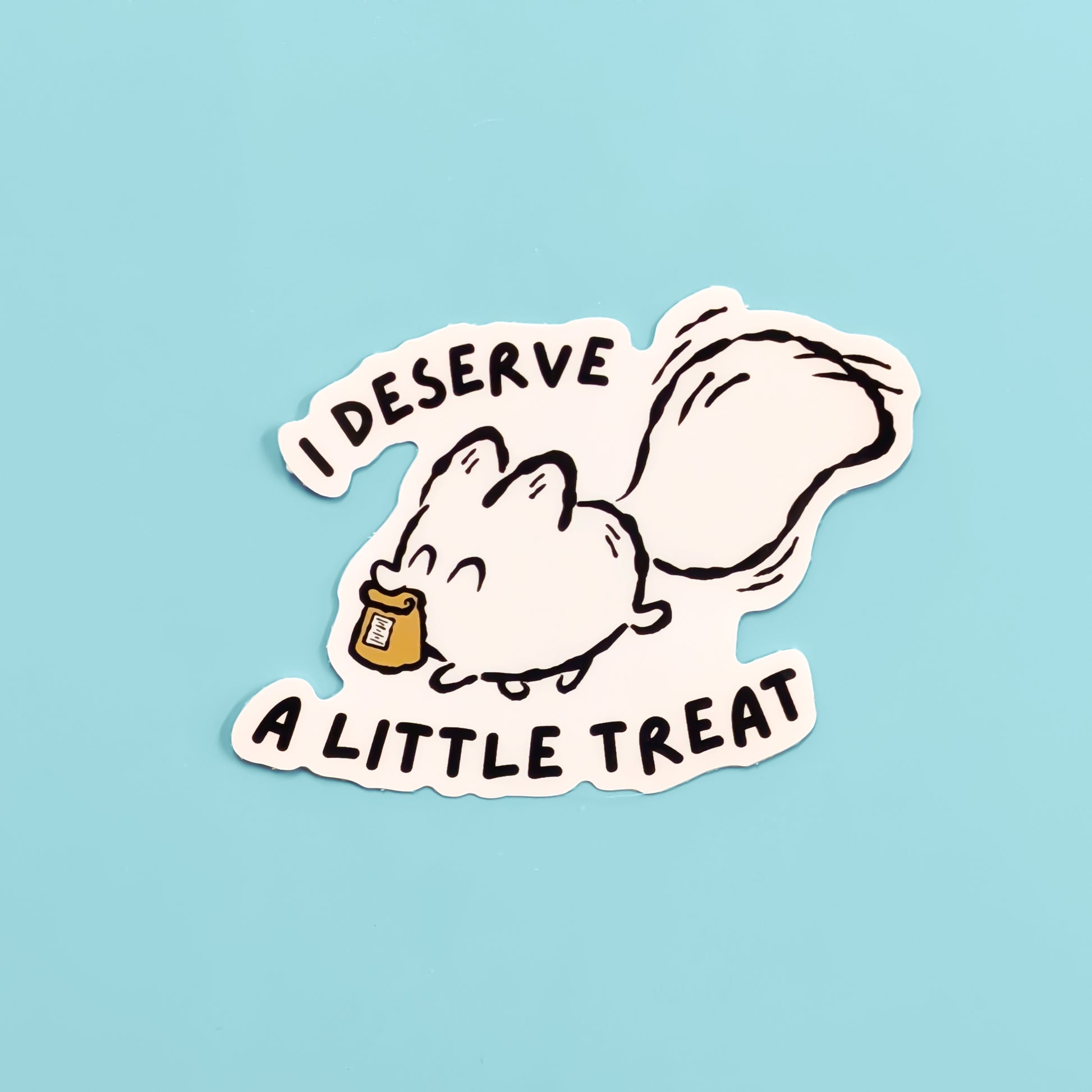 Cartoon white fox with a treat and text 'I DESERVE A LITTLE TREAT' on a light blue background