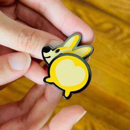 Bug the Corgi wiggle butt spring enamel pin by Made By Nao! Features a cute corgi with a playful, wiggling tail.