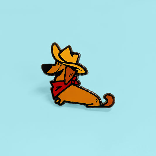 Cowboy dachshund enamel pin by Made By Nao! featuring a cute dachshund dog with cowboy hat and boots in colorful enamel.