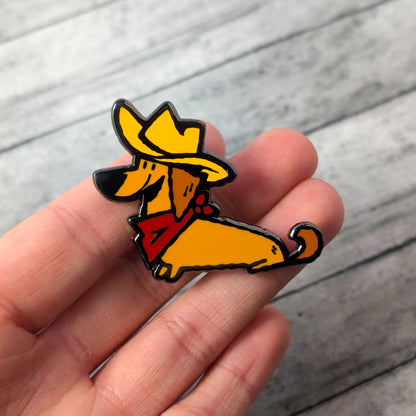Cowboy Dachshund Doxie Dog enamel pin by Made By Nao! featuring a cute dachshund in cowboy attire with enamel details.