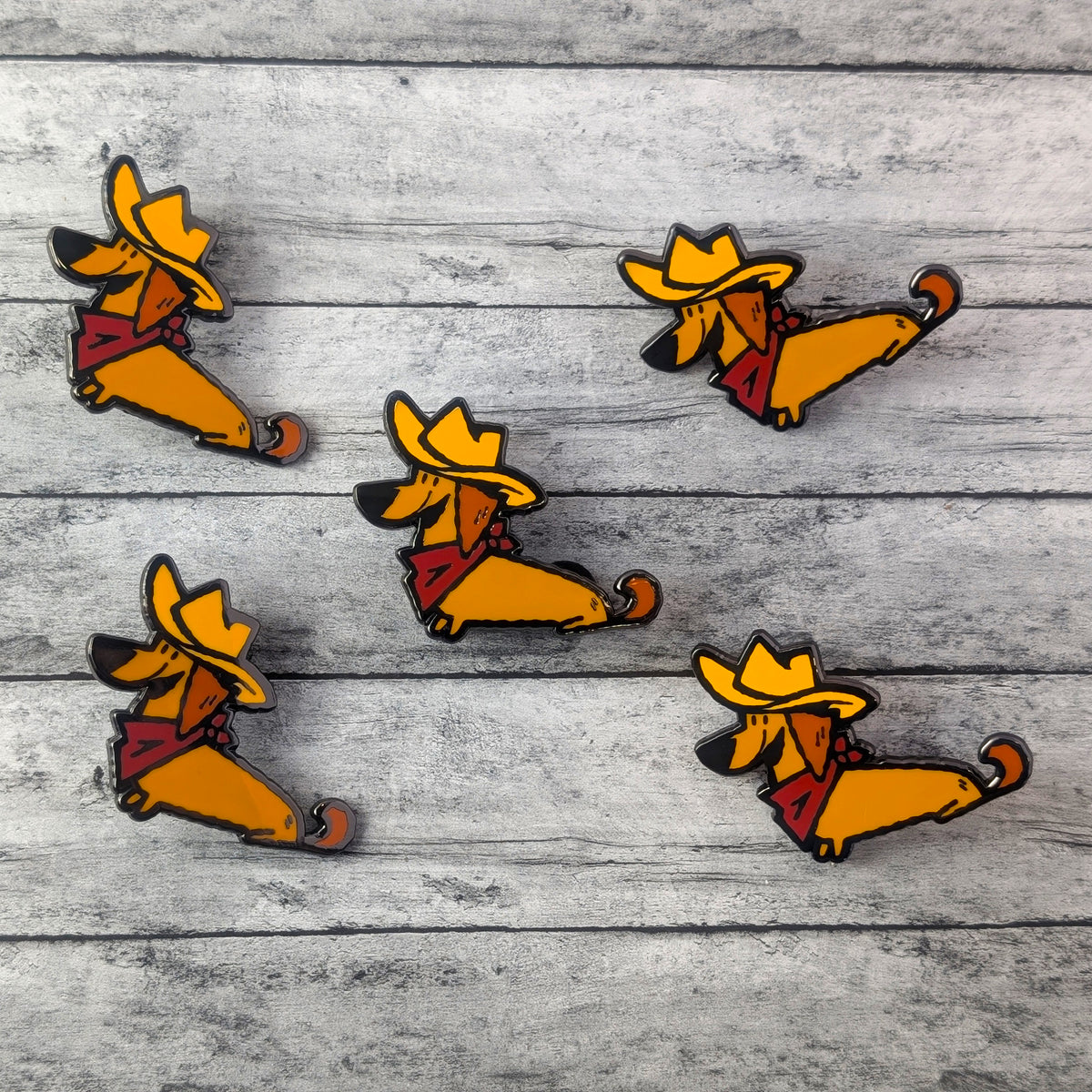 Cowboy Dachshund enamel pin by Made By Nao featuring a cute dachshund dog dressed as a cowboy with a western hat.