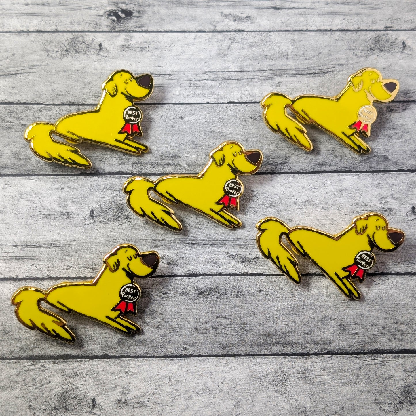 Golden Retriever Good Pooper enamel pin by Made By Nao! features a cute dog design on a metal pin with colorful enamel details.