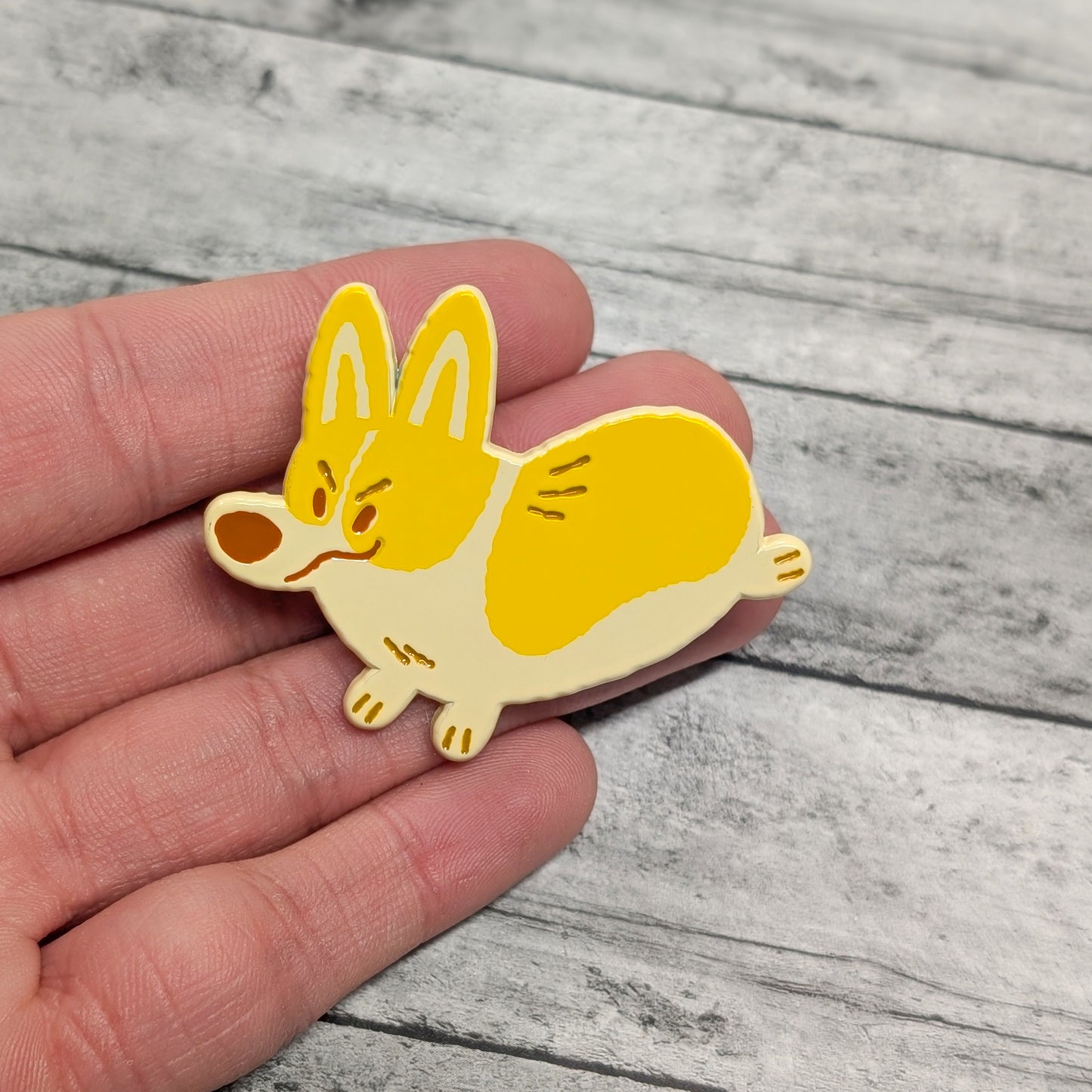 Pembroke Welsh Corgi enamel pin by Made By Nao! featuring a cute Corgi design on a metal pin backing.