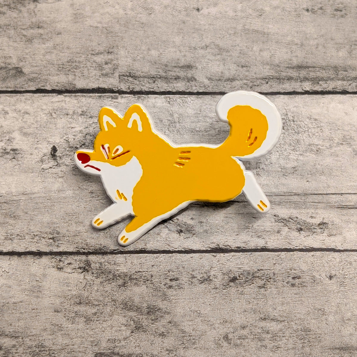 Shiba Inu enamel pin by Made By Nao! featuring a cute, detailed Shiba Inu dog design on a metal pin.
