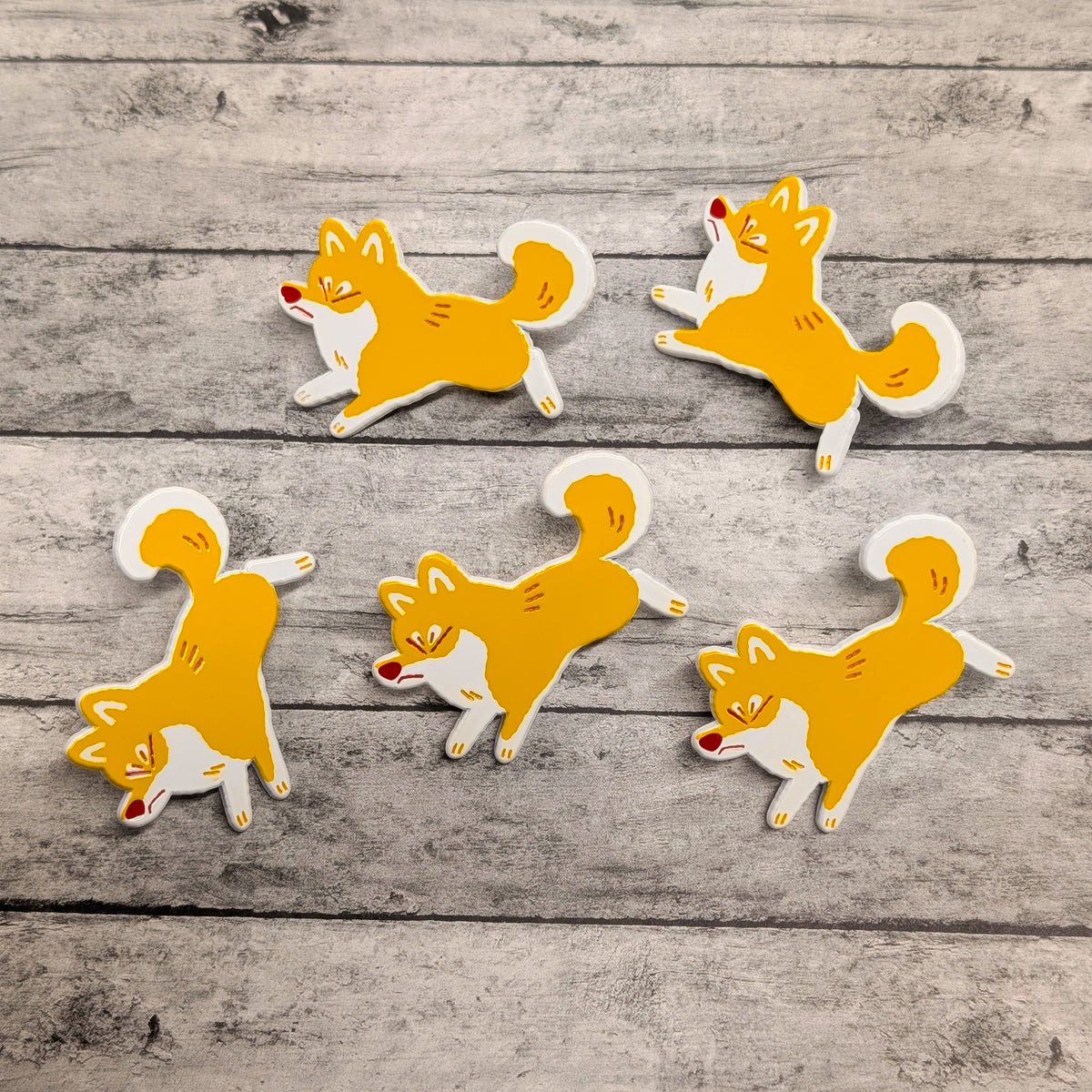 Shiba Inu enamel pin by Made By Nao! featuring a cute, detailed dog design on a metal pin with colorful enamel finish.