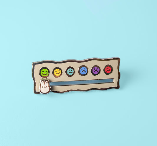 Sliding Mood Selector Anxiety Fox enamel pin by Made By Nao! featuring a colorful fox design and sliding mood indicator.