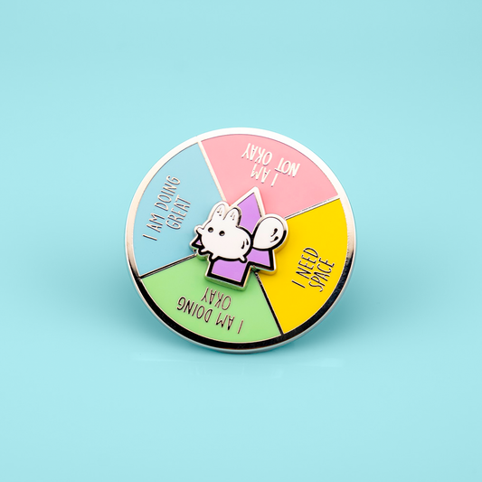 Made By Nao! Anxiety Fox enamel pin with spinner mood picker, featuring a colorful fox design and detailed enamel finish.