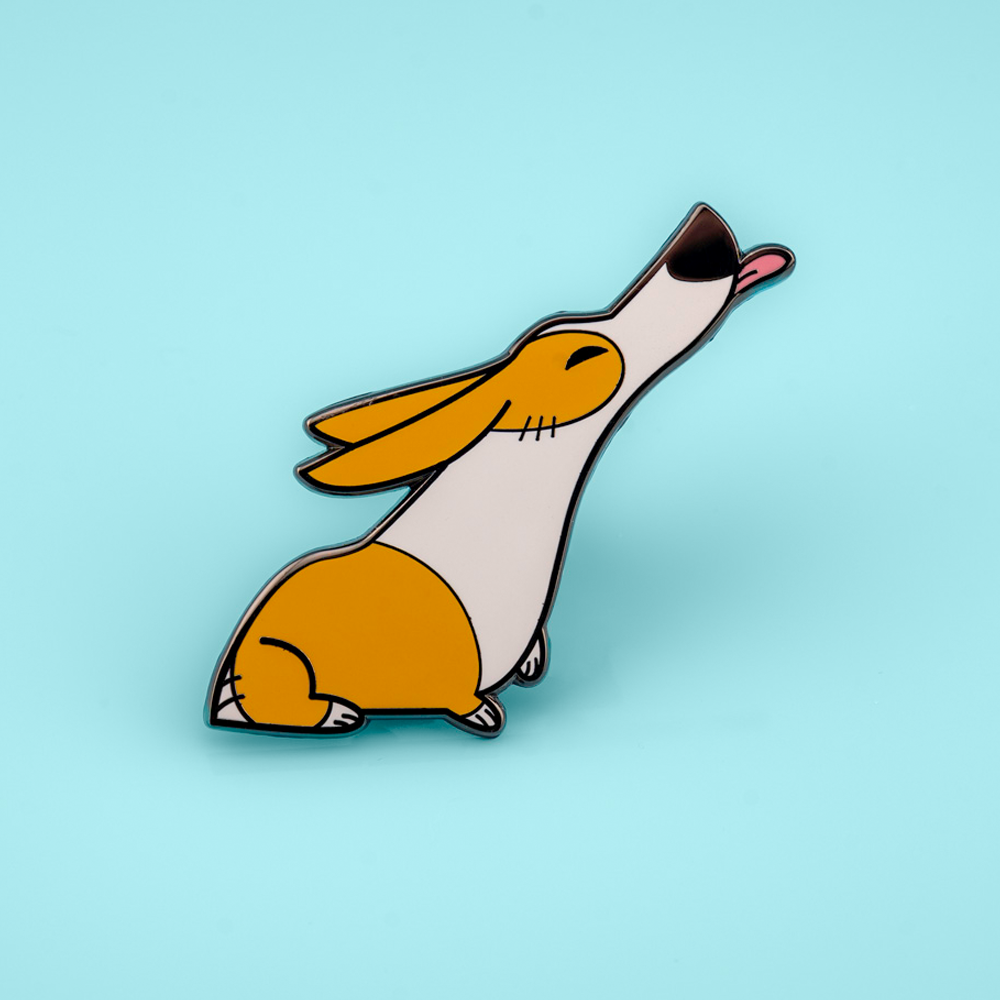 Orange Pembroke Welsh Corgis enamel pin by Made By Nao! featuring adorable dog designs on a metal pin backing.
