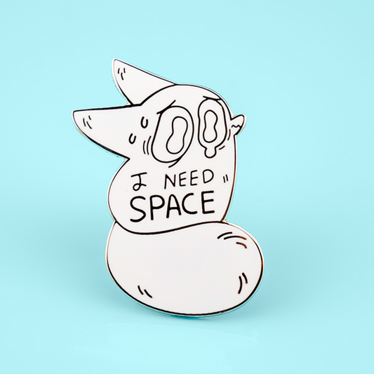 Close-up of the I Need Space Anxiety Fox enamel pin by Made By Nao! featuring a cute fox design on a space-themed background.