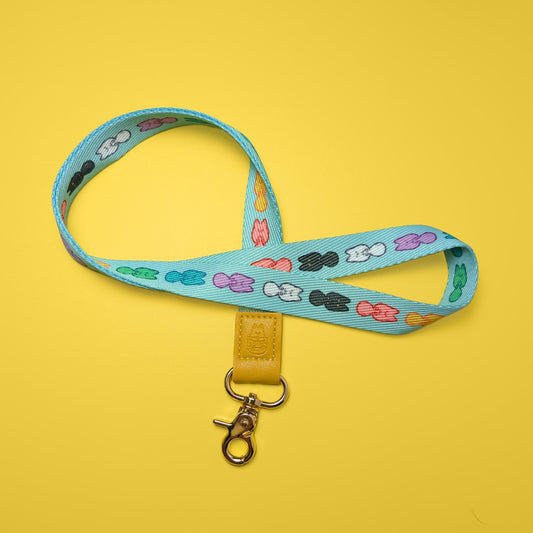 Colorful Pocket Friends lanyard by Made By Nao! featuring playful character designs and a secure clip for keys or ID cards.