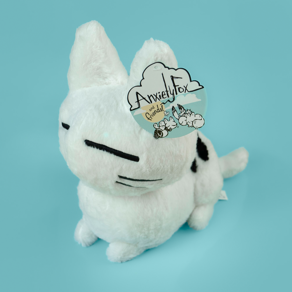 Large fluffy calming kitty plush from Made By Nao! soft, cuddly cat toy with a gentle expression and plush fur.