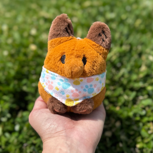Plush Pocket Friends Paws Bandana by Made By Nao! featuring a soft, colorful fabric with paw print design for pets.