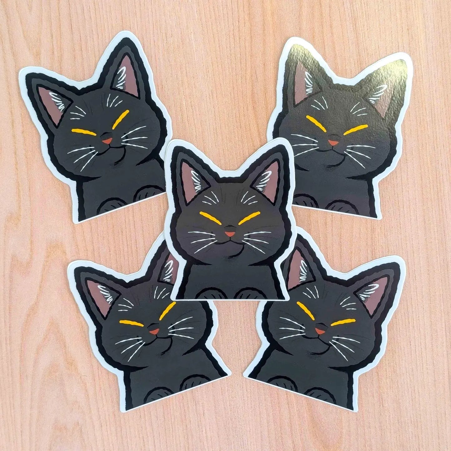 Black Cat Peeker vinyl sticker by Made By Nao! featuring a playful black cat design on durable adhesive sticker.