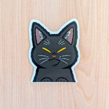 Black Cat Peeker vinyl sticker by Made By Nao! featuring a playful black cat peeking design on durable adhesive sticker.