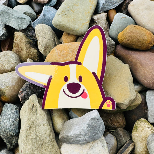 Bug the Corgi peeker sticker by Made By Nao! features a cute corgi peeking out with playful expression, ideal for decorating surfaces.