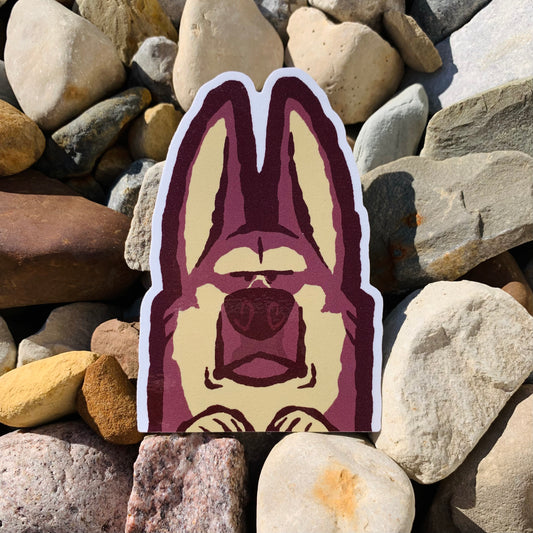 Weather-proof German Shepherd vinyl peeker sticker by Made By Nao! features detailed dog design, ideal for outdoor surfaces.