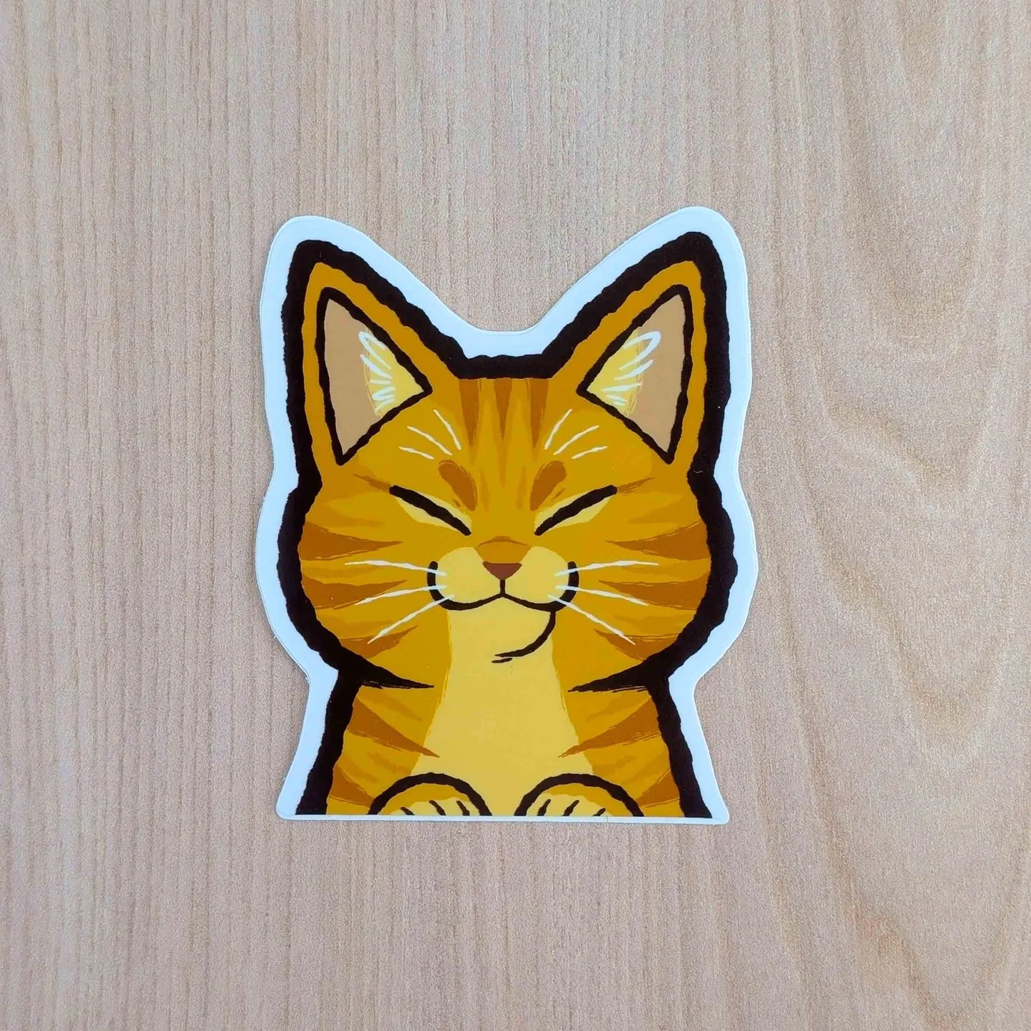 Orange Cat Peeker vinyl sticker by Made By Nao! featuring a cute feline peeking out, perfect for decorating laptops or notebooks.