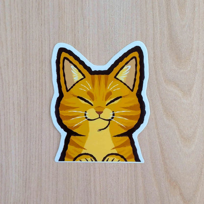 Orange Cat Peeker vinyl sticker by Made By Nao! featuring a cute feline peeking out, perfect for decorating laptops or notebooks.