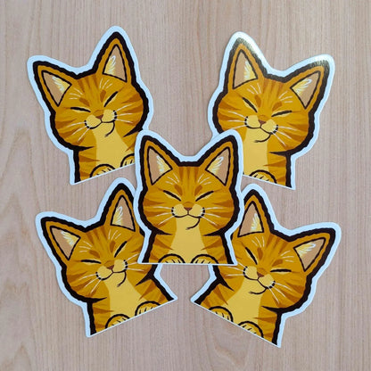 Orange Cat Peeker vinyl sticker by Made By Nao! featuring a playful cartoon cat peeking with vibrant orange colors.