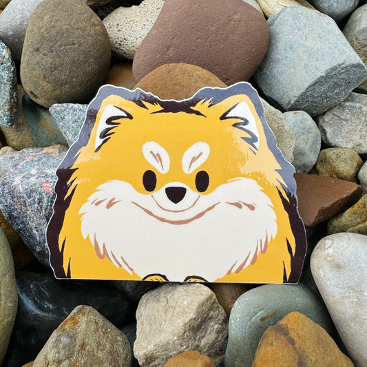 Weatherproof Pomeranian vinyl sticker by Made By Nao! Cute, durable sticker featuring a playful Pomeranian dog design.
