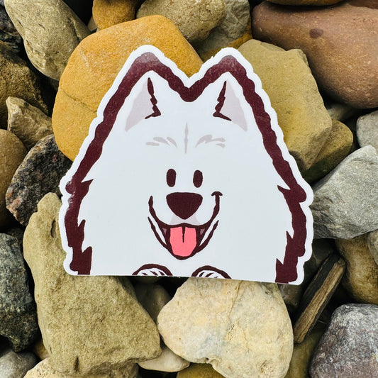 Weatherproof vinyl sticker featuring a playful Samoyed Peeker design by Made By Nao!