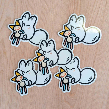 Snuggle Plush Anxiety Fox vinyl sticker by Made By Nao! featuring a cute fox design on a clear adhesive sticker.