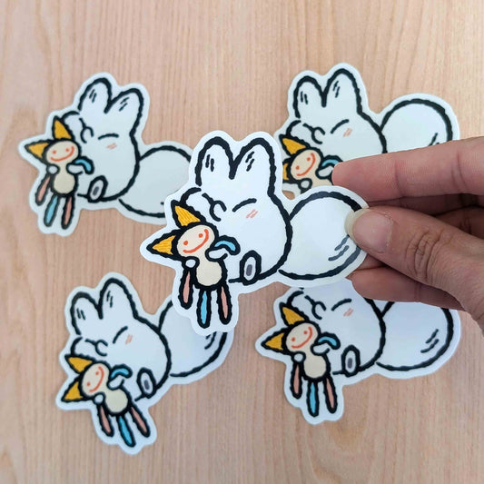 Snuggle Plush Anxiety Fox vinyl sticker by Made By Nao! featuring a cute fox design on a sticker.