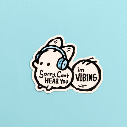 Funny vinyl sticker featuring an anxiety fox with the phrase "Sorry, Can't Hear You, I'm Vibing" by Made By Nao!
