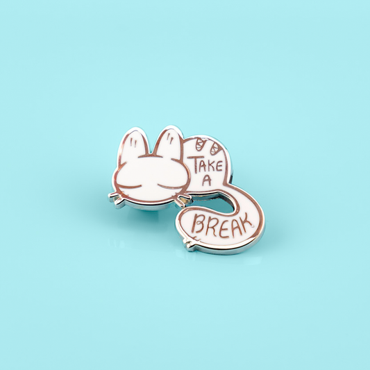 Calming kitty enamel pin by Naomi Romero Art featuring a cute feline design, perfect for accessorizing and collection.