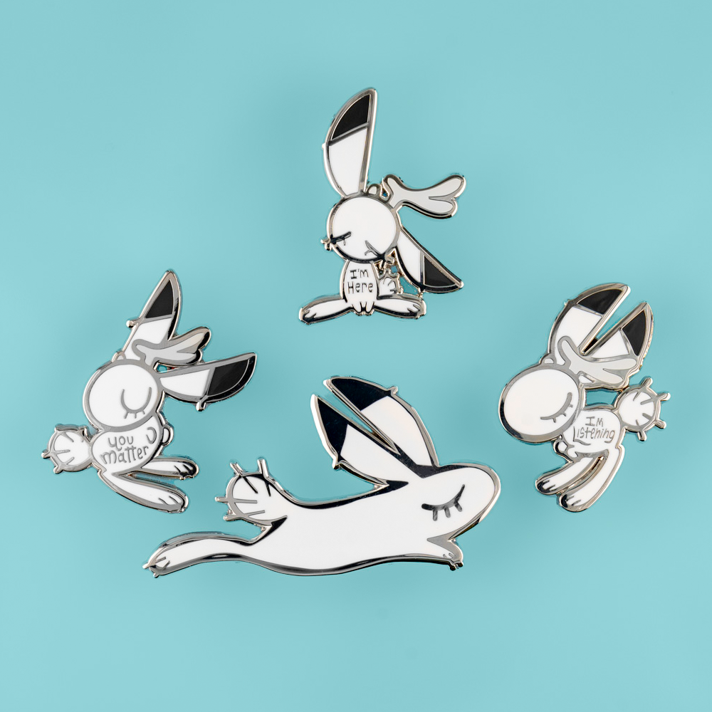 Support Bunny enamel pin by Naomi Romero Art, featuring a cute bunny design with the message "You Matter" in colorful enamel.