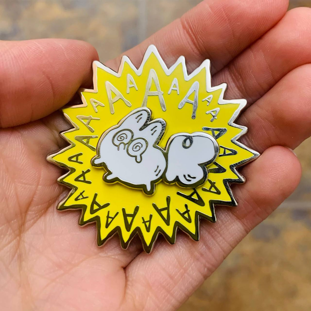 Made By Nao! AAAAAA Meltdown Spinner Anxiety Fox enamel pin featuring a detailed fox design on a vibrant pin backing.