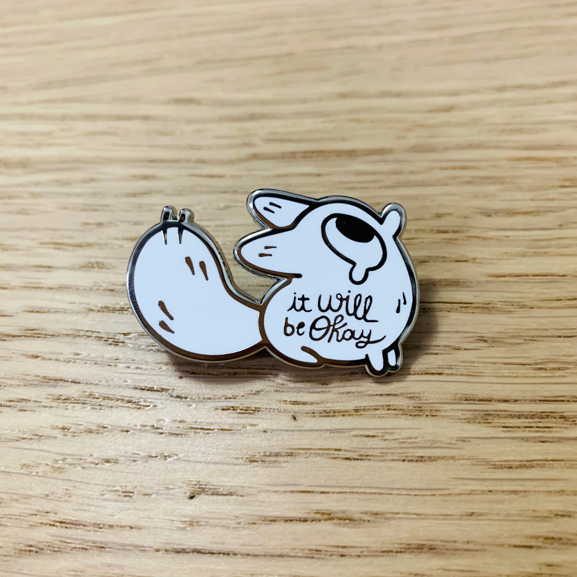 Anxiety fox enamel pin by Made By Nao! featuring a cute fox with a comforting message, suitable for attaching to clothing or accessories.